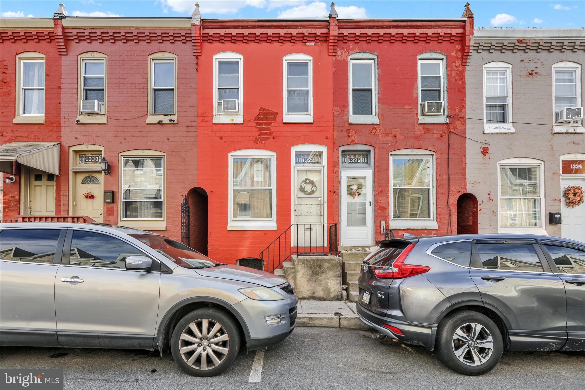 1328 Kenny Street Reading, PA 19602 - Photo 2 of 18 a front view of a house with parking space