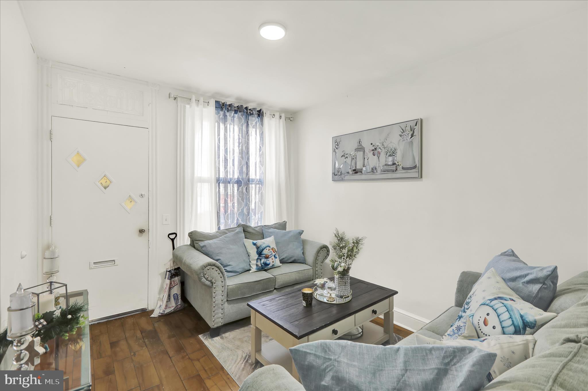 1328 Kenny Street Reading, PA 19602 - Photo 4 of 18 a living room with furniture and wooden floor