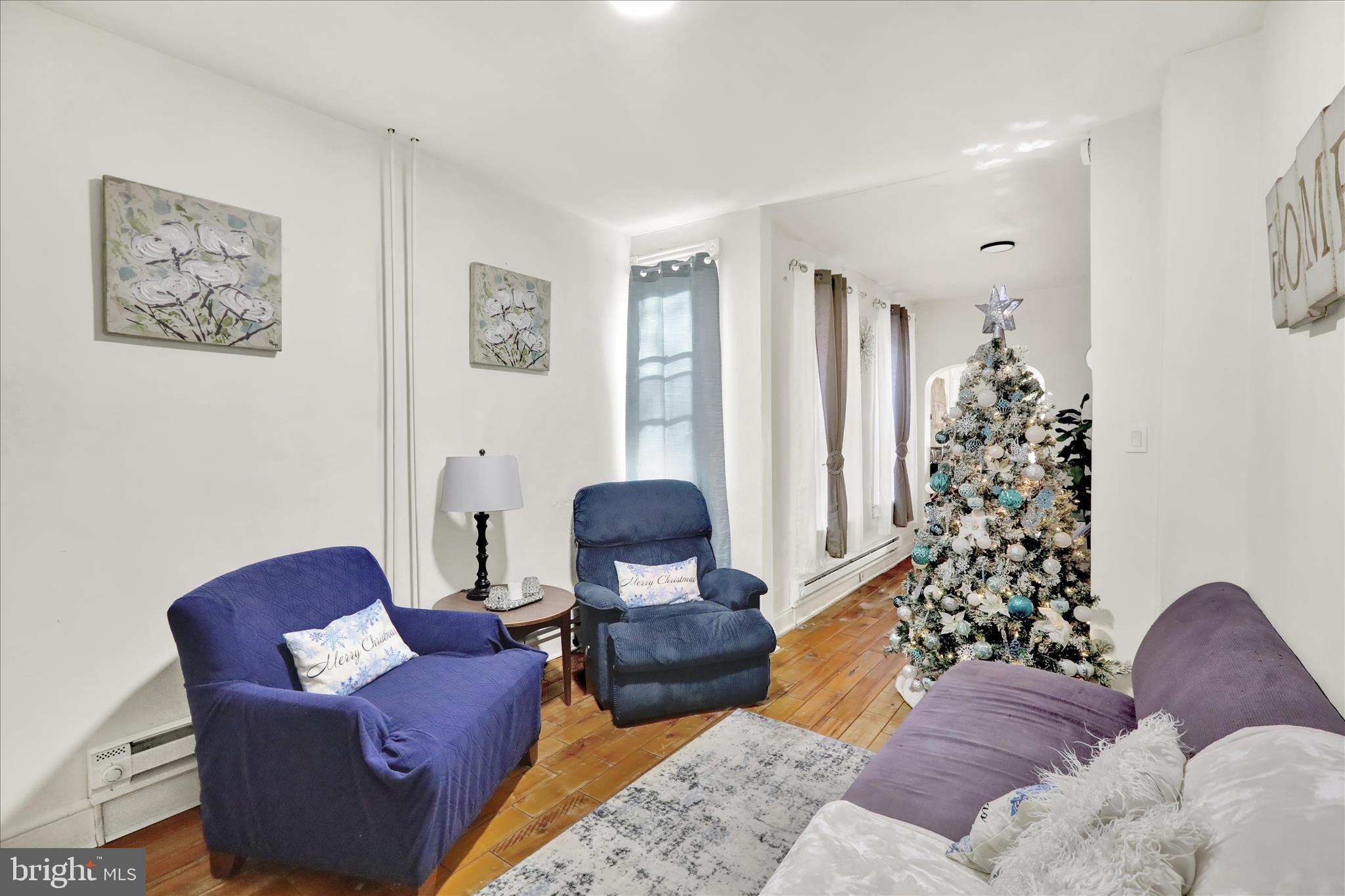 1328 Kenny Street Reading, PA 19602 - Photo 5 of 18 a living room with furniture plant and a window