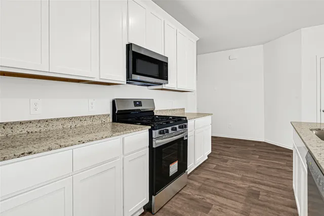 a kitchen with a refrigerator and countertop