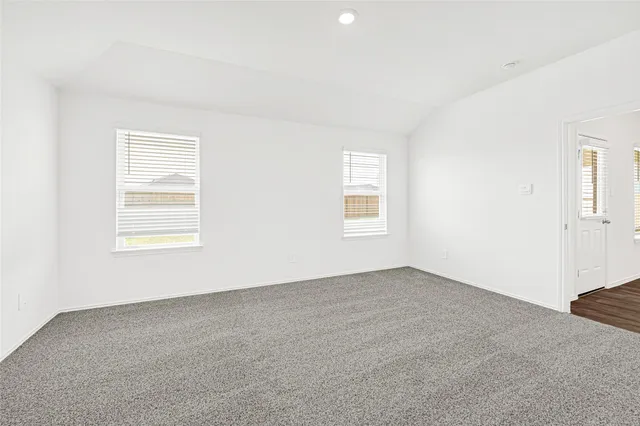 an empty room with a empty space and window