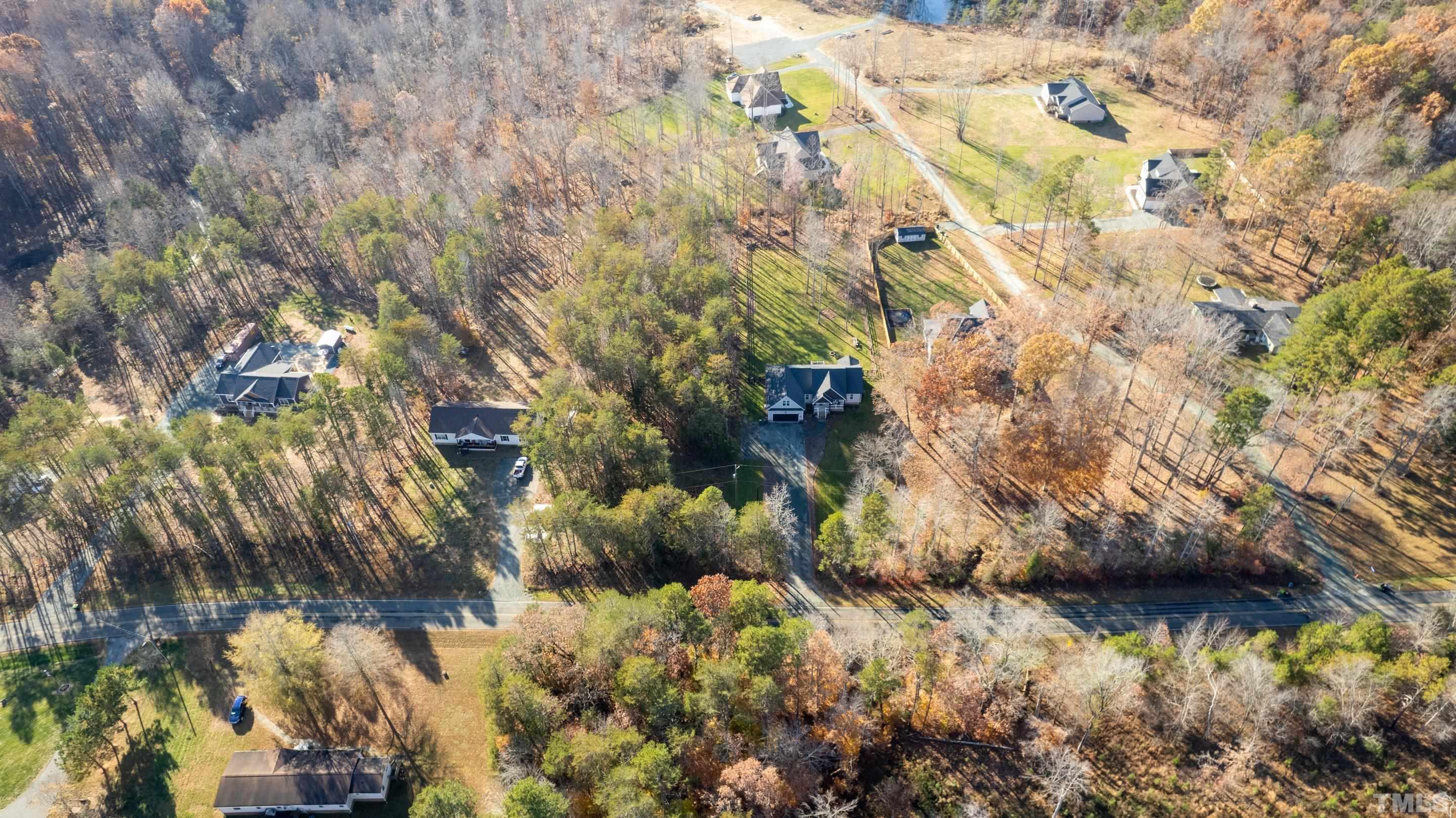 4045 Clapp Mill Road Burlington, NC 27215 - Photo 2 of 23 a view of a lake in middle of forest