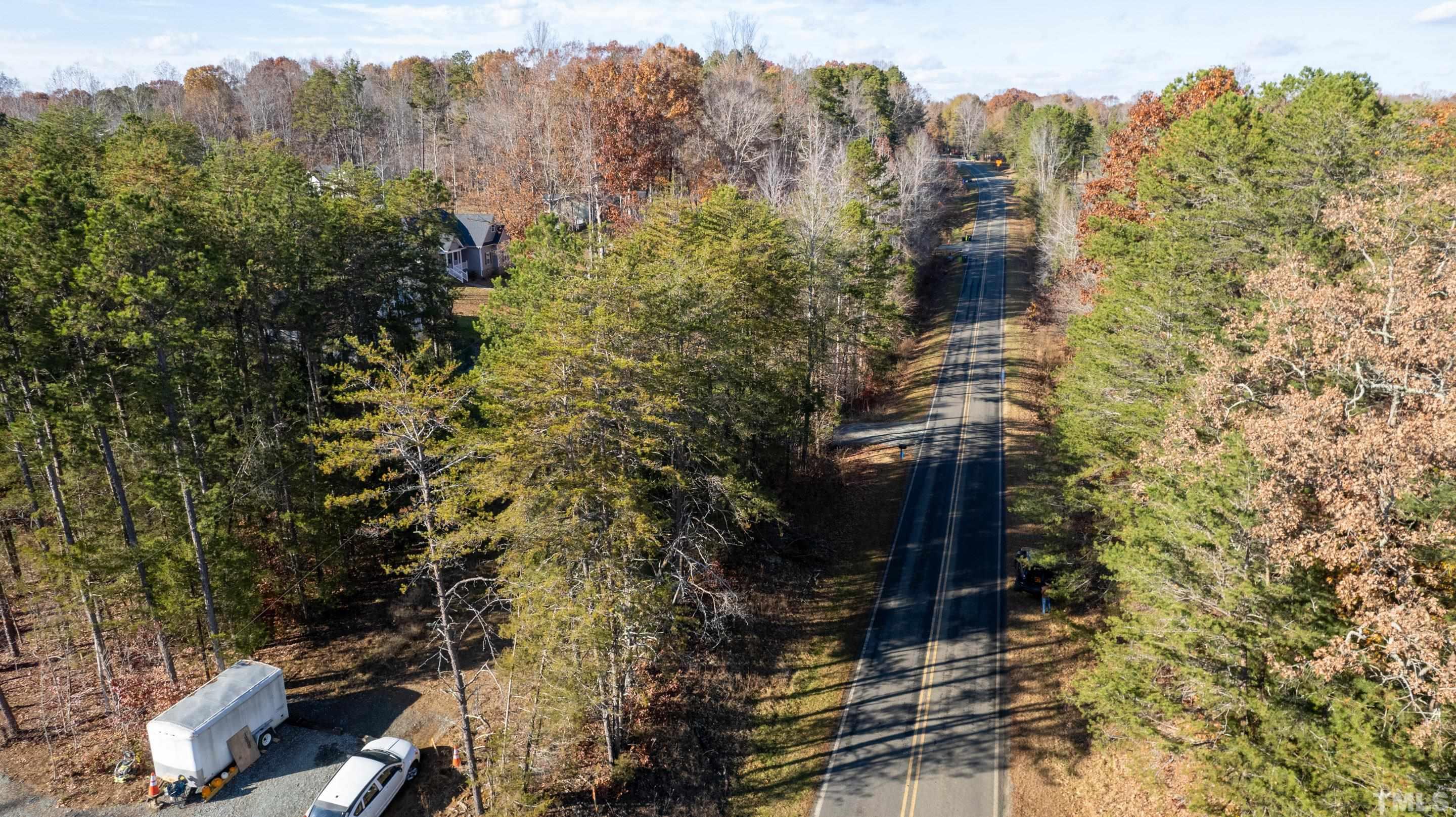 4045 Clapp Mill Road Burlington, NC 27215 - Photo 19 of 23 a view of a city with lush green forest
