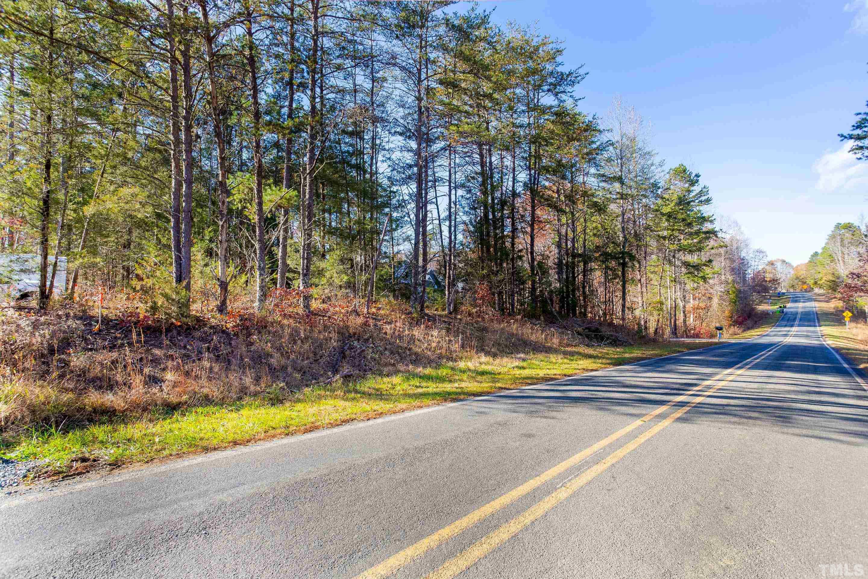 4045 Clapp Mill Road Burlington, NC 27215 - Photo 22 of 23 a view of a yard with yellow house