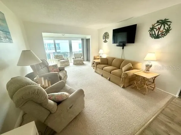a living room with furniture and a table