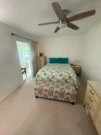 a bedroom with a bed and a mirror