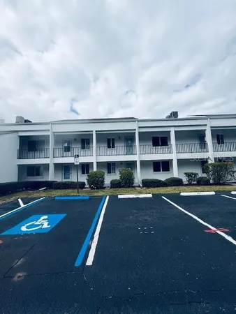 a view of pool table and chairs in front of house