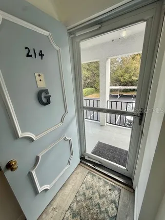 a living room with furniture and a gate