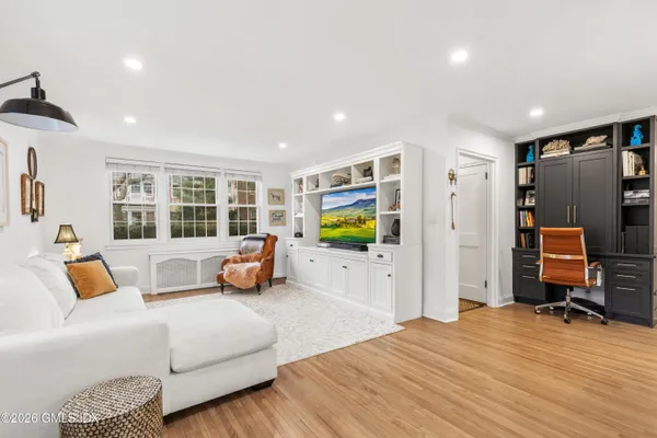 a bedroom with a bed a couch and dresser