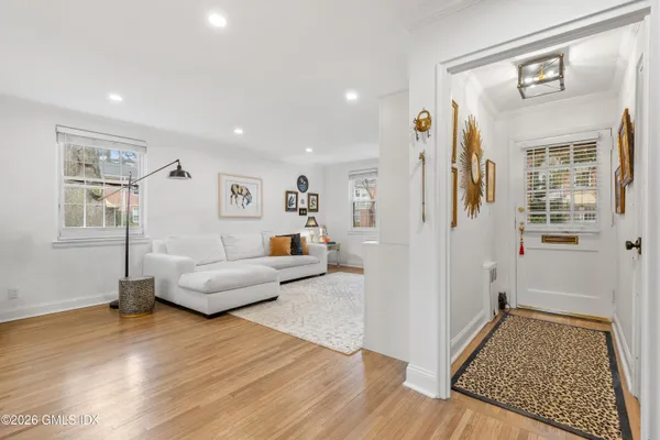 a living room with furniture and a rug