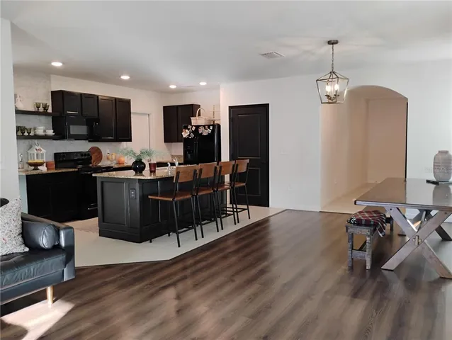 a workspace with furniture window and wooden floor