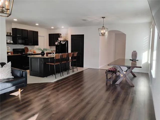 a view of a backyard with wooden fence