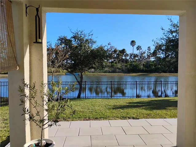 a view of a pathway with a garden