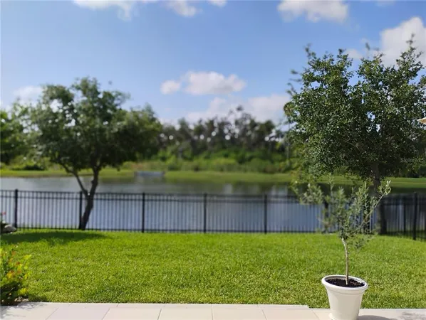 a balcony with furniture and a garden