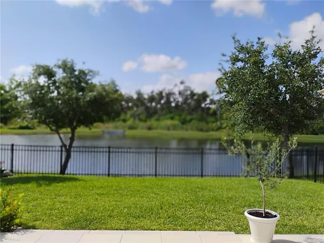 a balcony with furniture and a garden