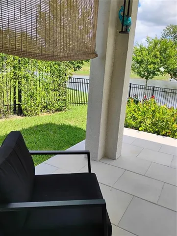 a view of swimming pool with wooden fence