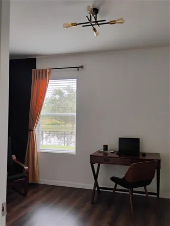 a bedroom with a bed and a cabinet