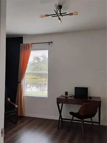 a bedroom with a bed and a cabinet