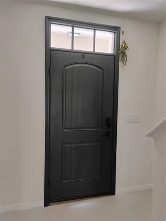 a bedroom with a bed and lamp