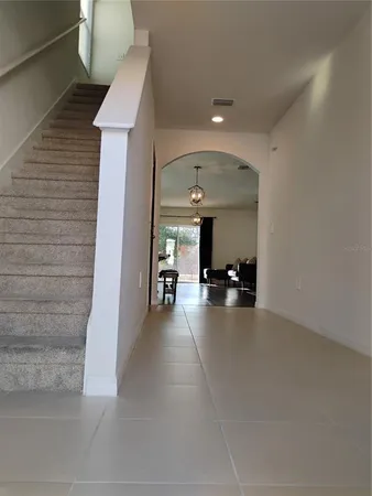 a view of a livingroom with furniture window and wooden floor