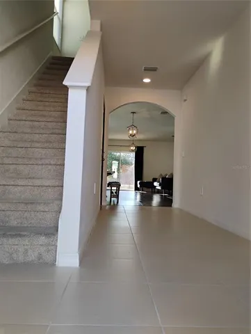 a view of a livingroom with furniture window and wooden floor