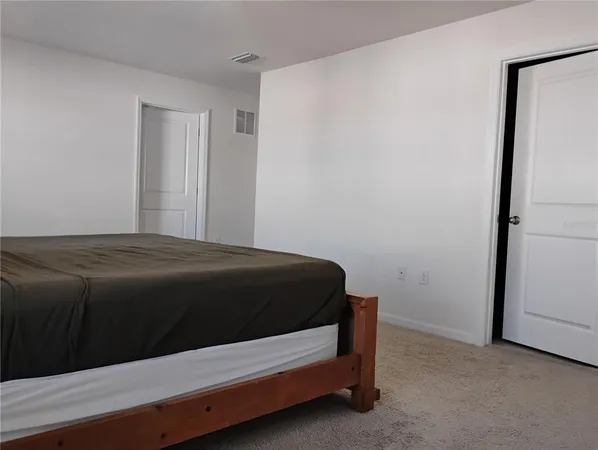 a view of a bathroom with a sink and a shower
