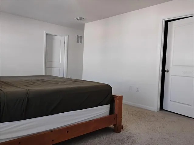 a view of a bathroom with a sink and a shower