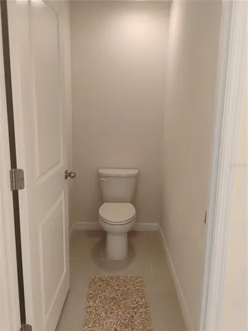 a front view of a house with a yard table and chairs