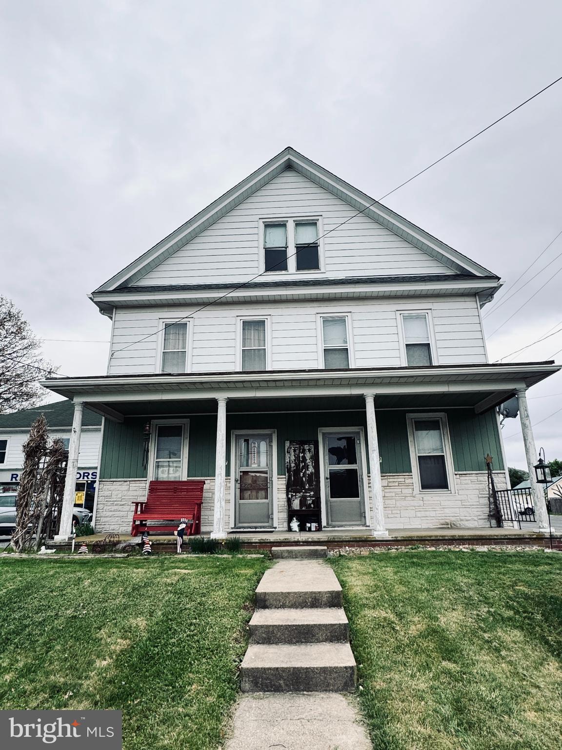 1137 West Main Street Valley View, PA 17983 - Photo 20 of 21 a front view of a house with a garden and porch