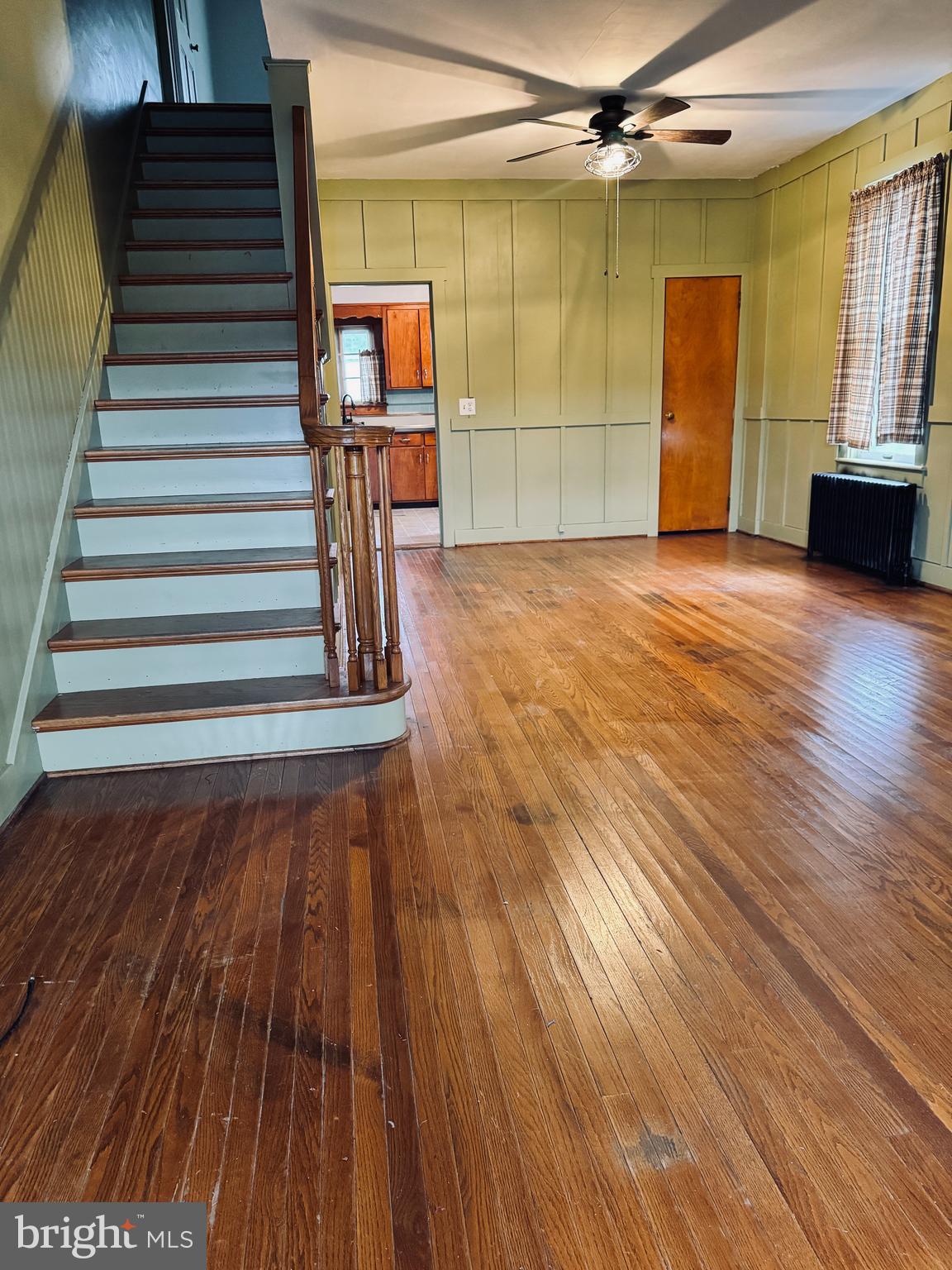 1137 West Main Street Valley View, PA 17983 - Photo 8 of 21 a view of a livingroom with wooden floor and a ceiling fan