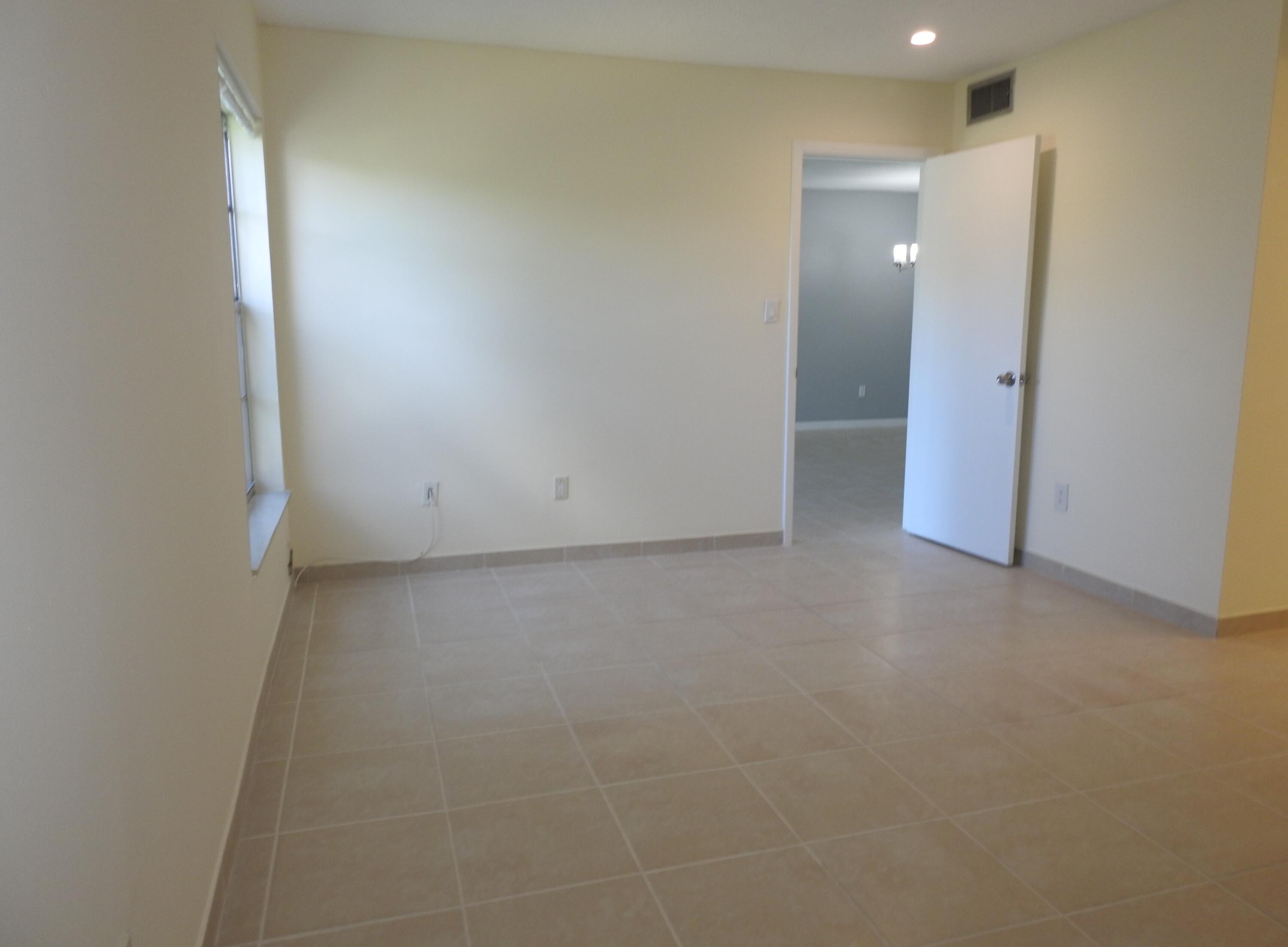 2600 Fiore Way, Unit 210 Delray Beach, FL 33445 - Photo 15 of 38 Primary Bedroom