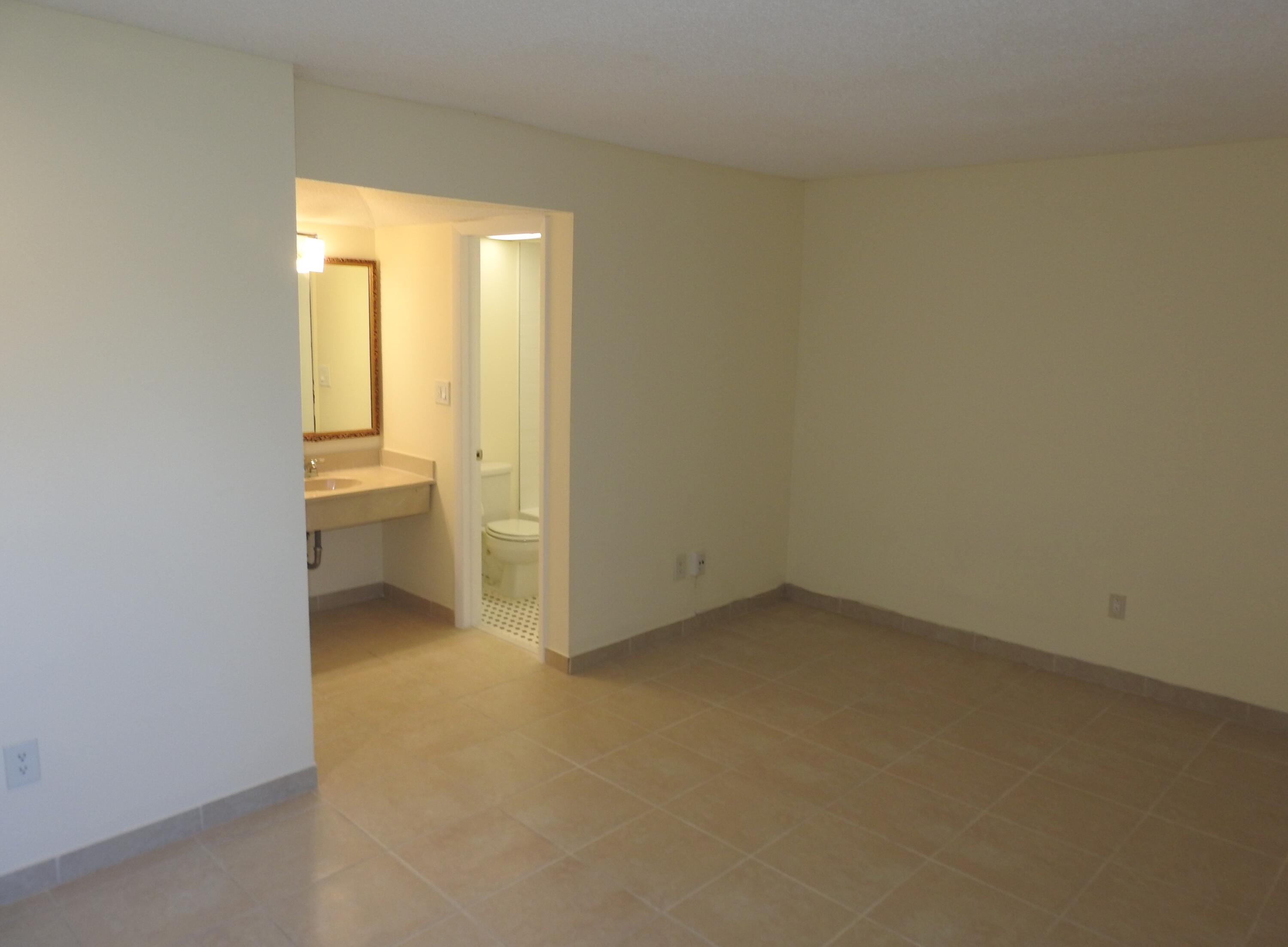 2600 Fiore Way, Unit 210 Delray Beach, FL 33445 - Photo 16 of 38 Primary Bedroom