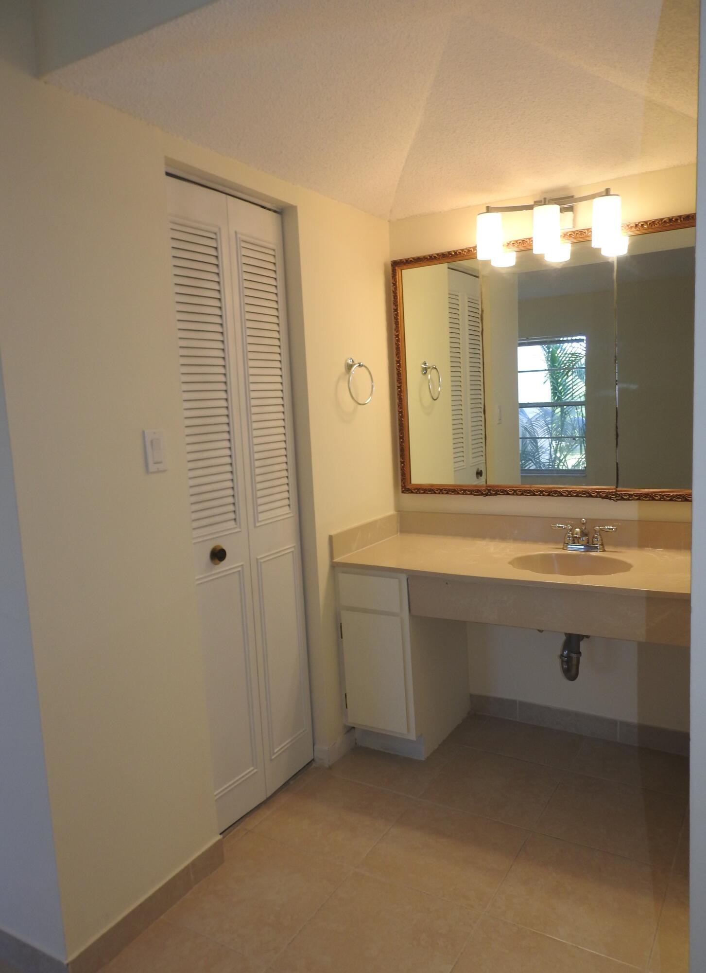 2600 Fiore Way, Unit 210 Delray Beach, FL 33445 - Photo 19 of 38 Primary Closet entrance -1