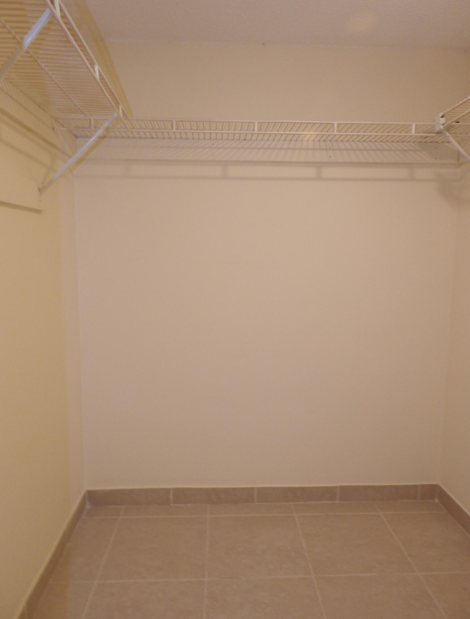 2600 Fiore Way, Unit 210 Delray Beach, FL 33445 - Photo 20 of 38 Primary Closet