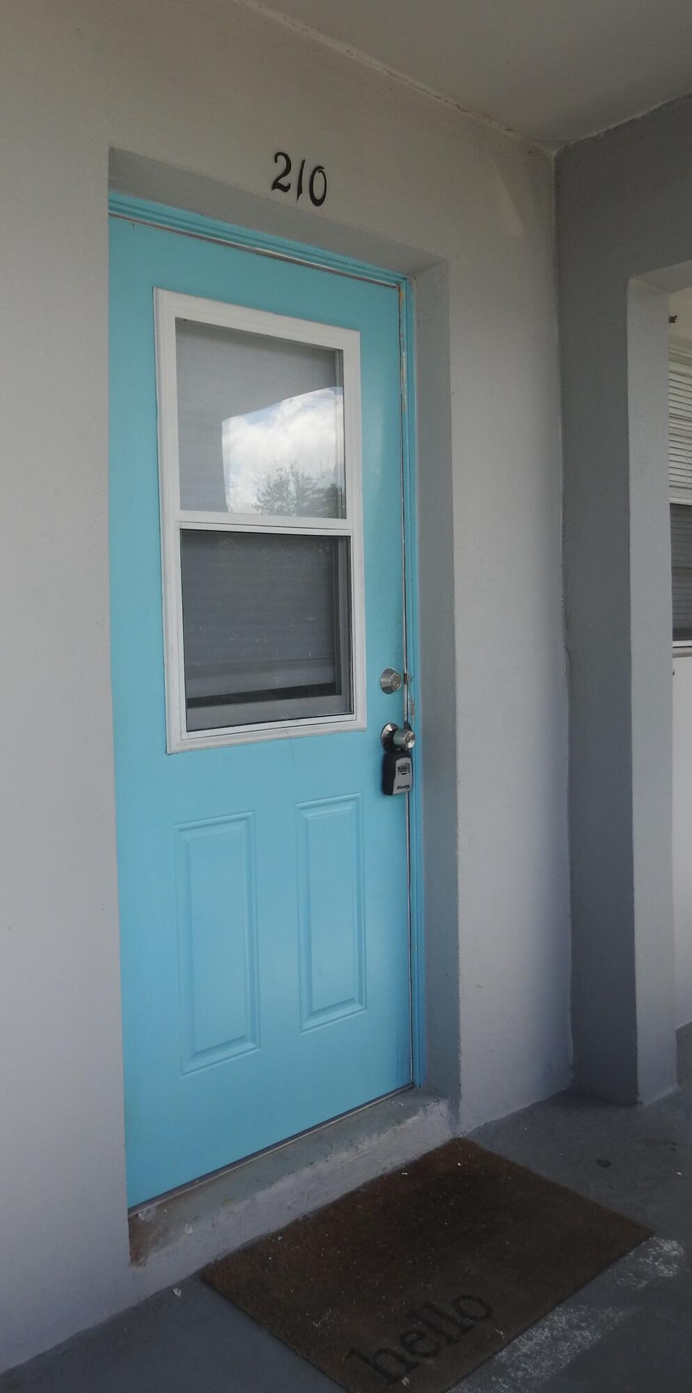 2600 Fiore Way, Unit 210 Delray Beach, FL 33445 - Photo 3 of 38 Front Door