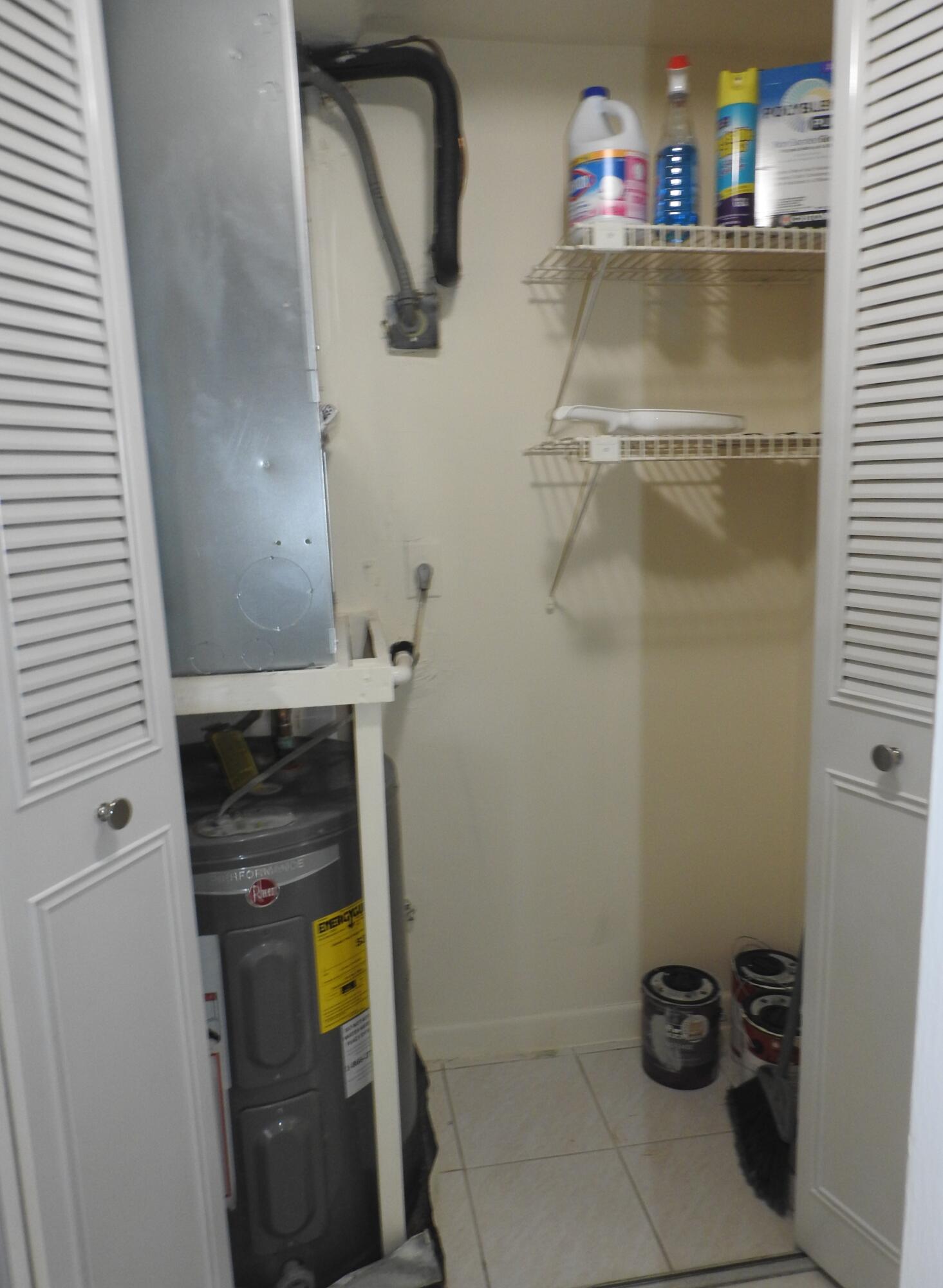 2600 Fiore Way, Unit 210 Delray Beach, FL 33445 - Photo 36 of 38 AC- Hot water heater Storage closet