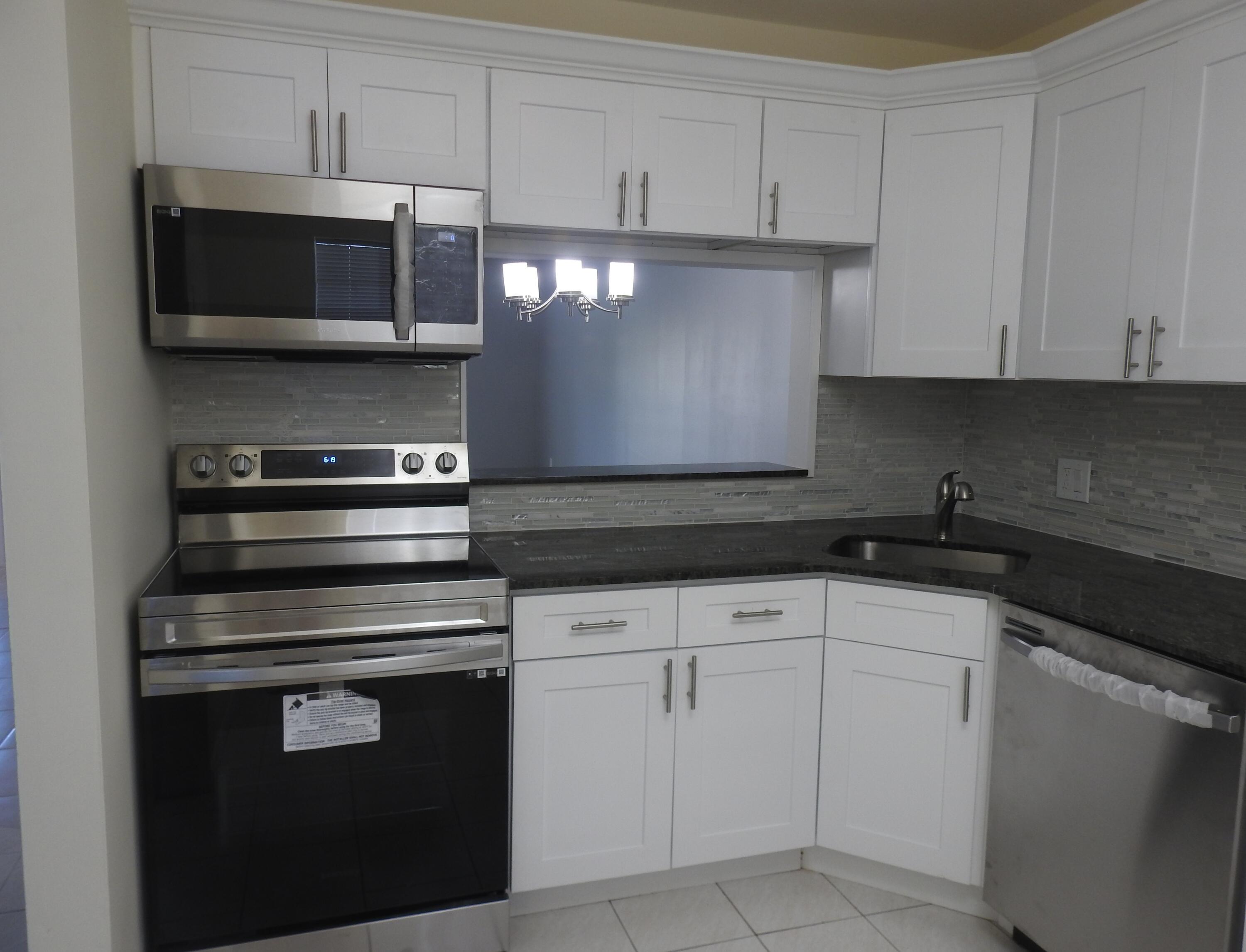 2600 Fiore Way, Unit 210 Delray Beach, FL 33445 - Photo 5 of 38 Kitchen
