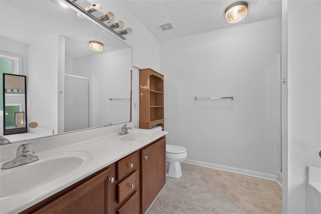 602 Pendergrass Road Winder, GA 30680 - Photo 24 of 44 a bathroom with a sink and a mirror