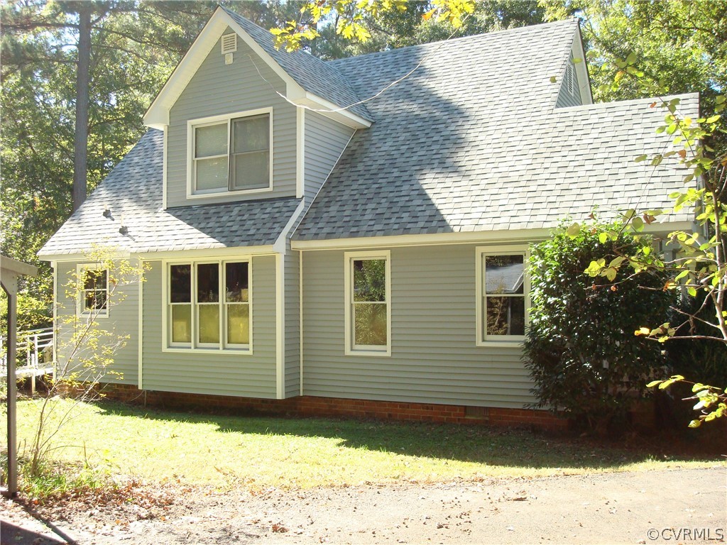 13611 Bailey Bridge Road Midlothian, VA 23112 - Photo 3 of 25 a front view of a house with a yard