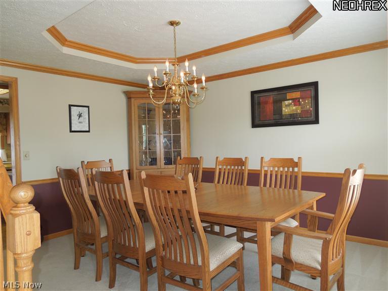 3828 Boston Road Brunswick, OH 44212 - Photo 5 of 16 Formal Dining Room with Chair Railing, Double Crowm Molding and Octagon Tray Ceiling!