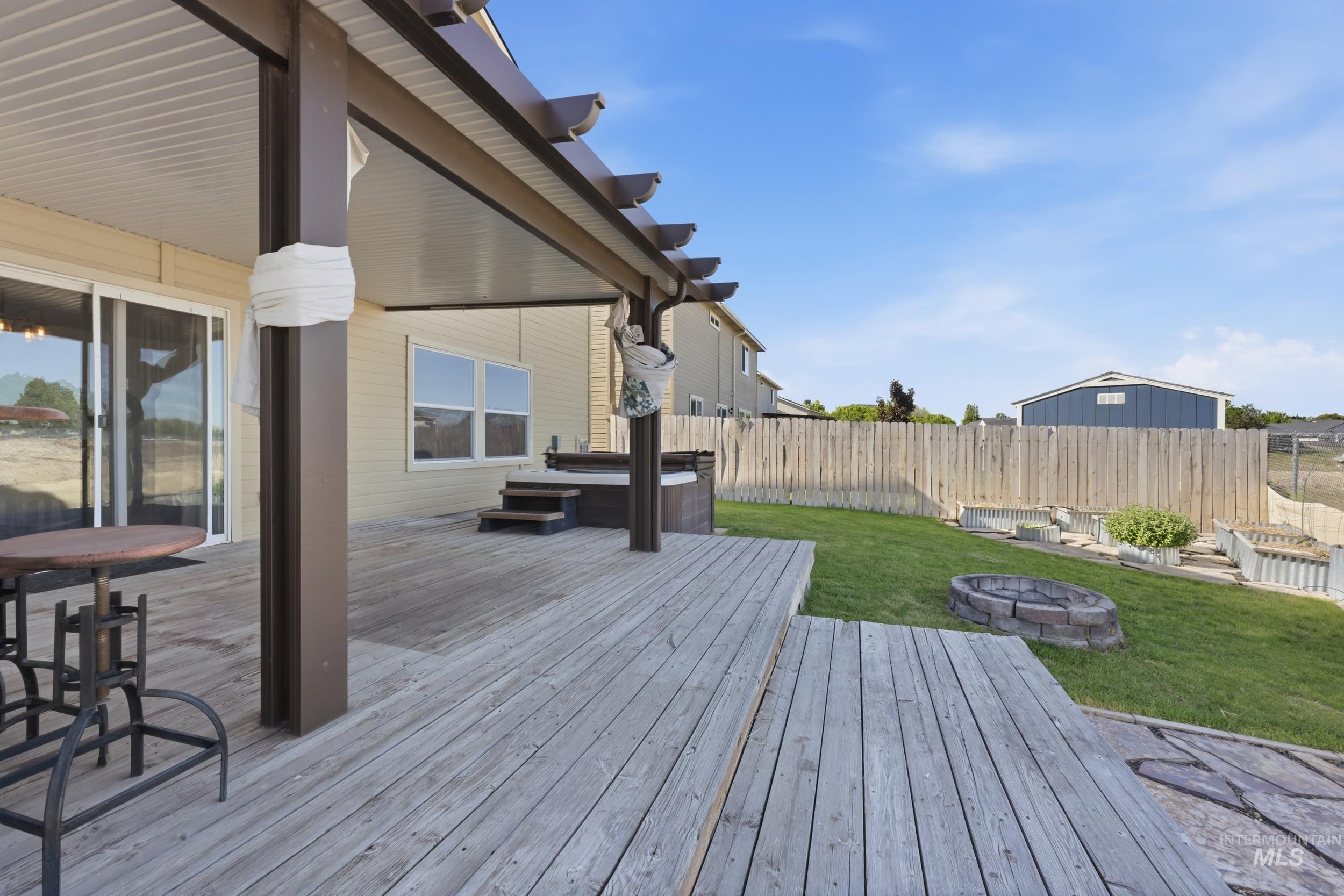 4855 South Chex Way Boise, ID 83709 - Photo 35 of 47 Expansive wood deck with a partial pergola covering