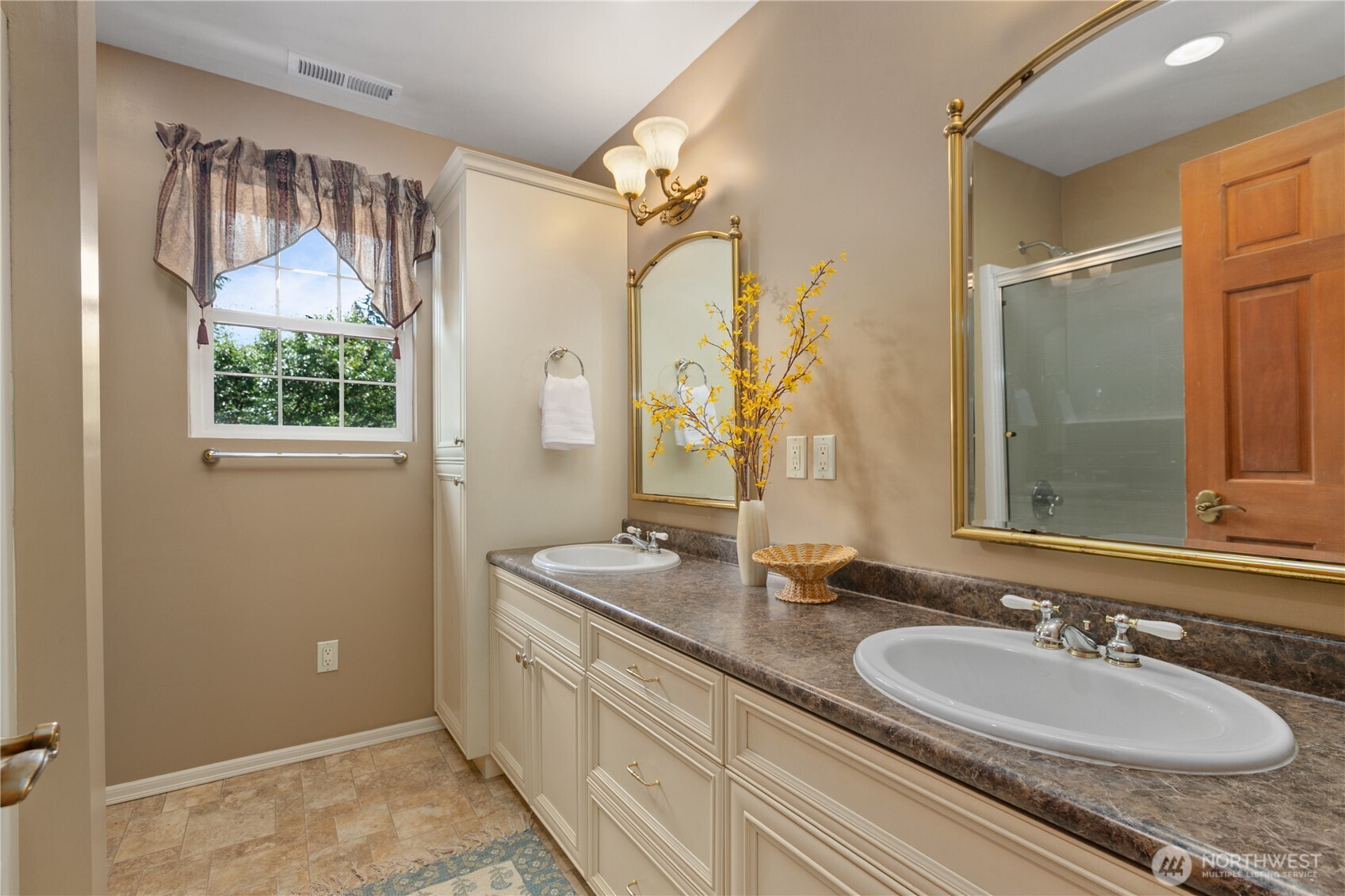 1788 Matz Road Ferndale, WA 98248 - Photo 25 of 40 a bathroom with a granite countertop double vanity sink a mirror and a shower