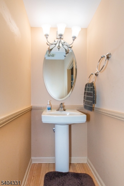 404 Manchester Drive Nutley, NJ 07110 - Photo 13 of 26 a bathroom with a sink and mirror