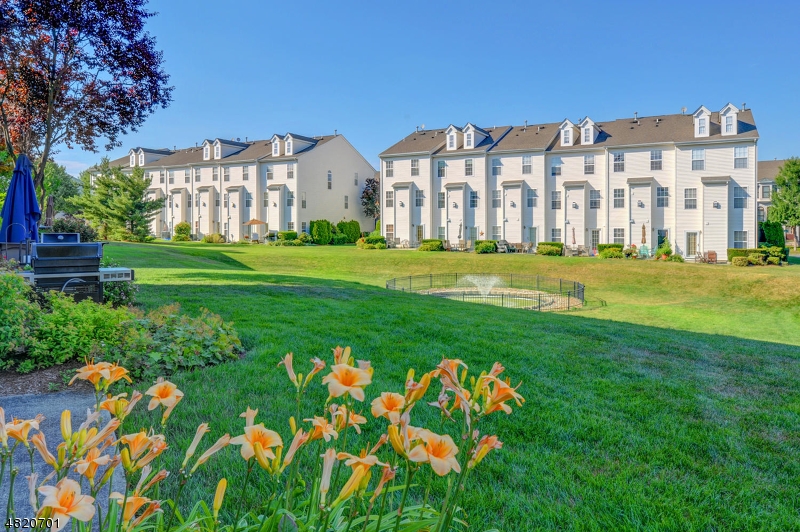 404 Manchester Drive Nutley, NJ 07110 - Photo 25 of 26 a view of a big room with a big yard and plants