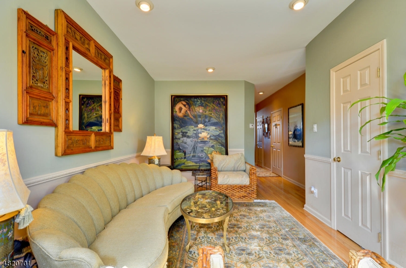 404 Manchester Drive Nutley, NJ 07110 - Photo 5 of 26 a living room with furniture and wooden floor