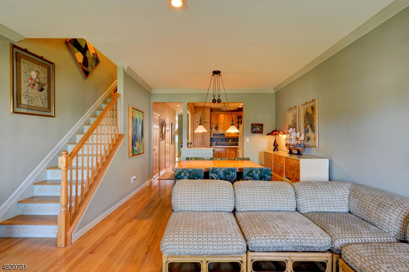 404 Manchester Drive Nutley, NJ 07110 - Photo 10 of 26 a living room with chairs and kitchen view