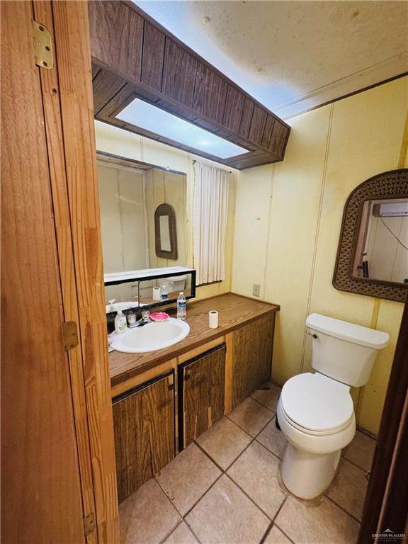 8007 Tex Mex Road Edinburg, TX 78542 - Photo 17 of 24 a bathroom with a toilet sink and mirror