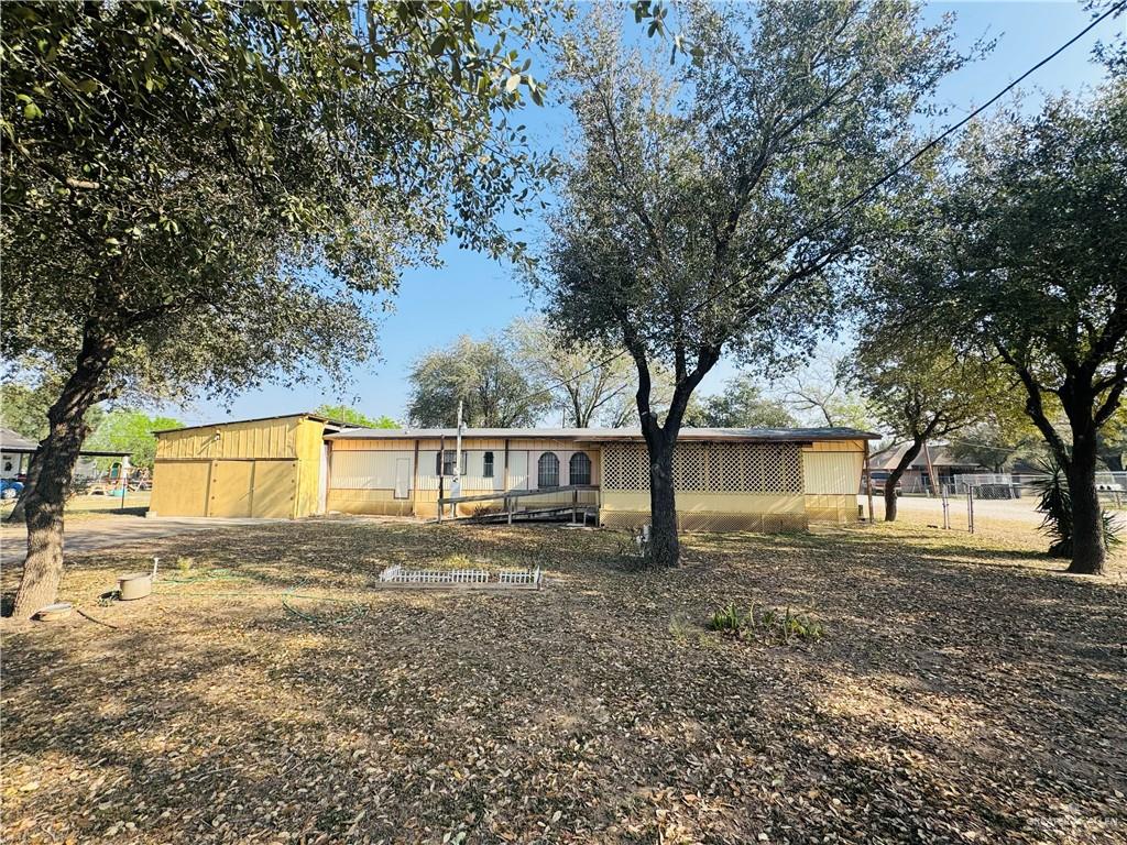 8007 Tex Mex Road Edinburg, TX 78542 - Photo 2 of 24 front view of house with a trees