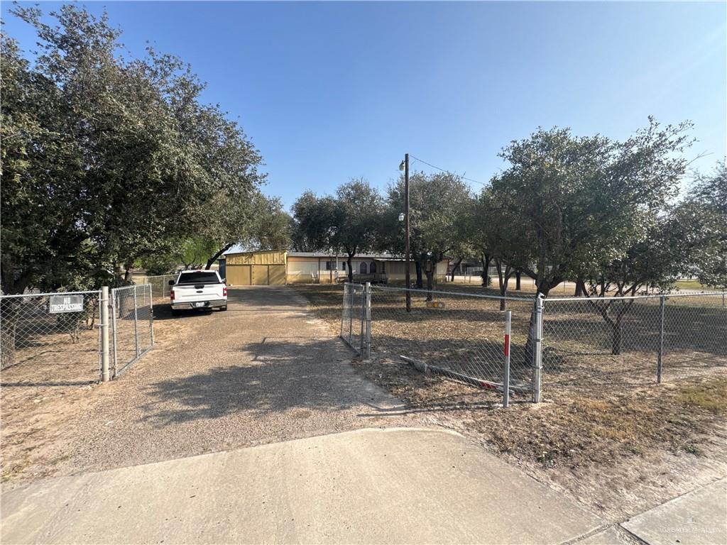 8007 Tex Mex Road Edinburg, TX 78542 - Photo 21 of 24 a street view with a bench