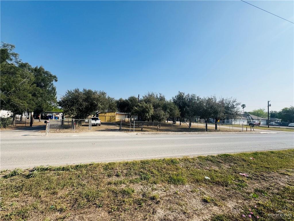 8007 Tex Mex Road Edinburg, TX 78542 - Photo 22 of 24 a view of a street with a building and trees in the background